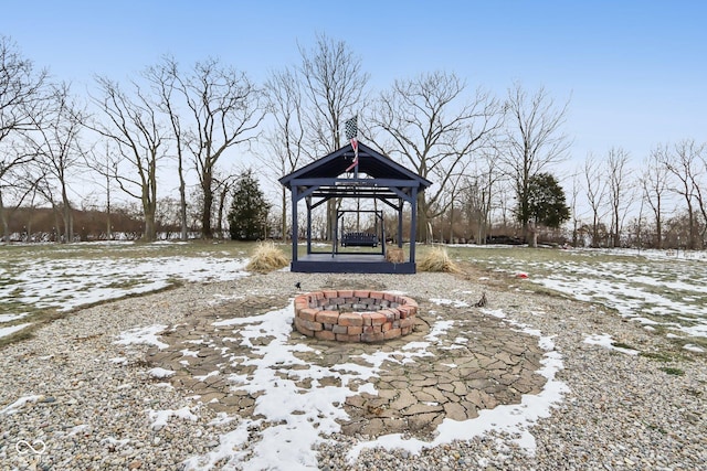 exterior space featuring a fire pit and a gazebo