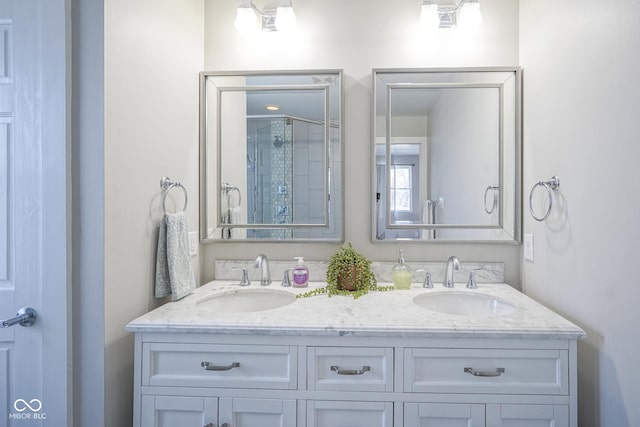 bathroom featuring vanity and a shower with shower door