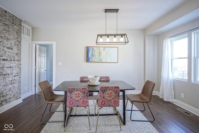 dining area with dark hardwood / wood-style floors