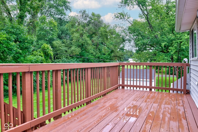 wooden terrace with a yard