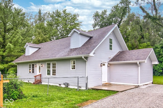 cape cod-style house with a patio and a front yard