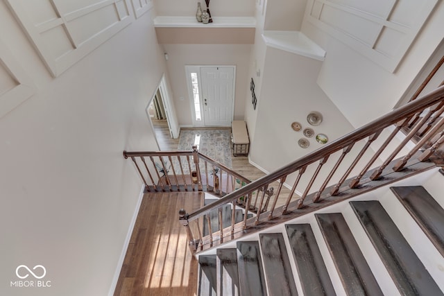 stairway featuring hardwood / wood-style flooring