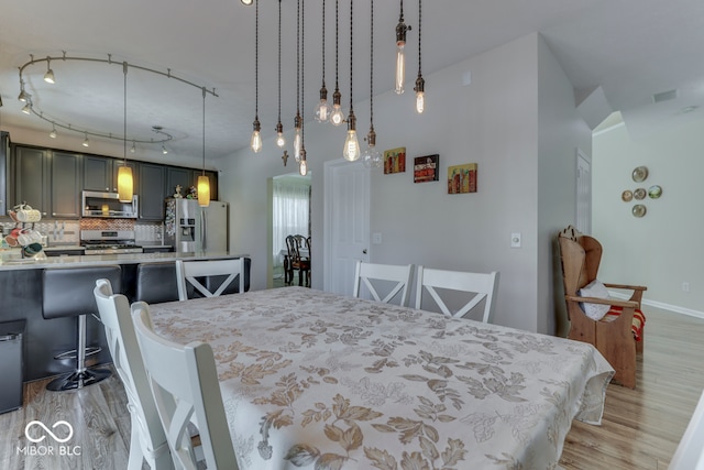 dining area featuring light wood-type flooring