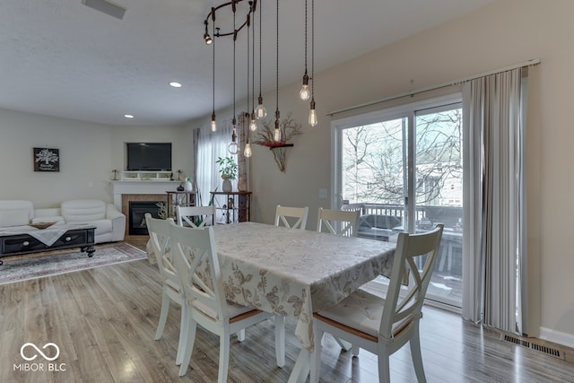 dining space featuring light hardwood / wood-style floors