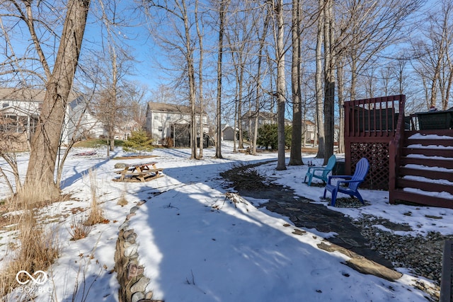 view of yard layered in snow