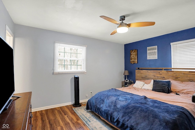 bedroom featuring ceiling fan and dark hardwood / wood-style floors