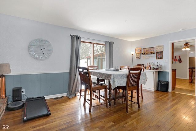 dining room featuring ceiling fan and wood-type flooring