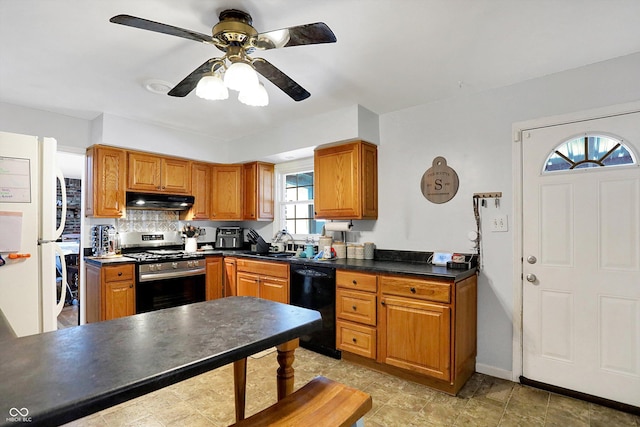 kitchen featuring sink, gas stove, tasteful backsplash, dishwasher, and white fridge