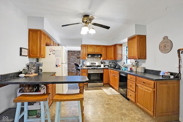 kitchen featuring stainless steel stove, dishwasher, backsplash, ceiling fan, and kitchen peninsula