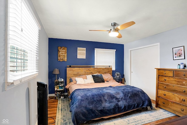 bedroom featuring hardwood / wood-style floors and ceiling fan