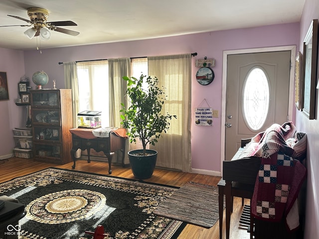 entrance foyer with ceiling fan and hardwood / wood-style floors