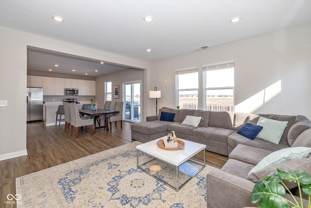 living room with dark wood-type flooring