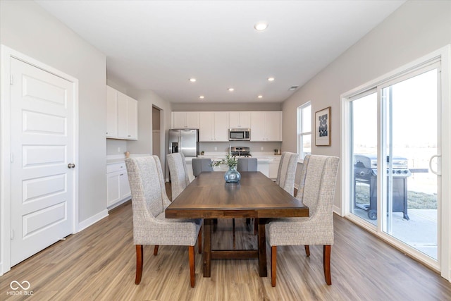 dining area with light wood-type flooring