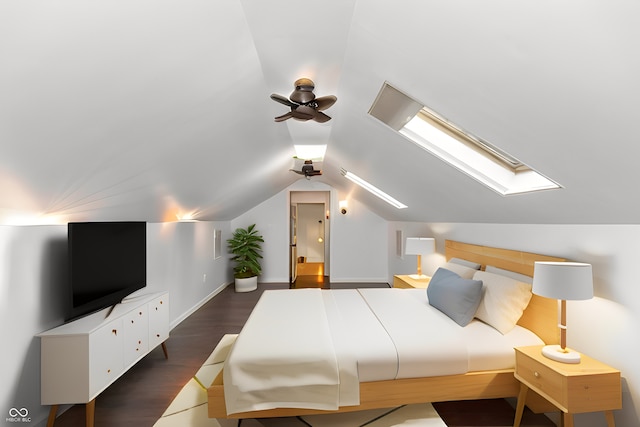 bedroom with ceiling fan, vaulted ceiling with skylight, and dark hardwood / wood-style flooring