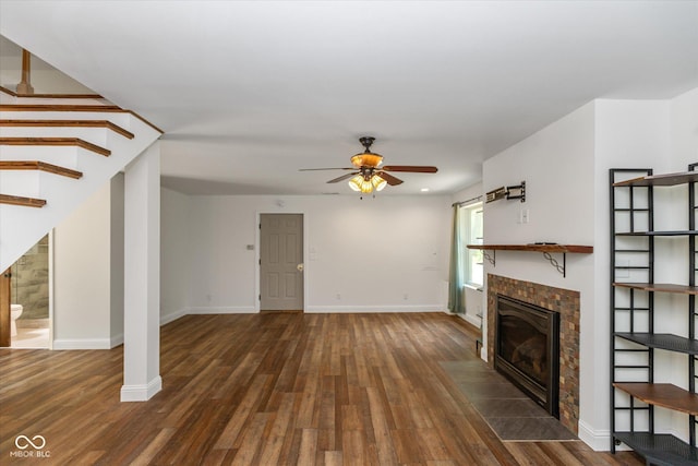 unfurnished living room with ceiling fan and dark hardwood / wood-style floors