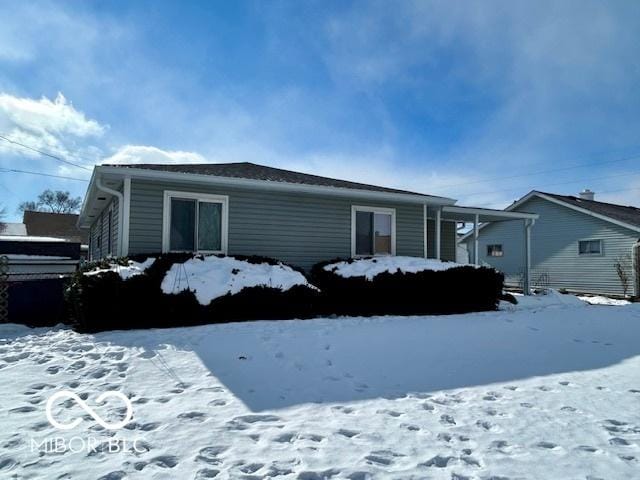 view of snow covered property