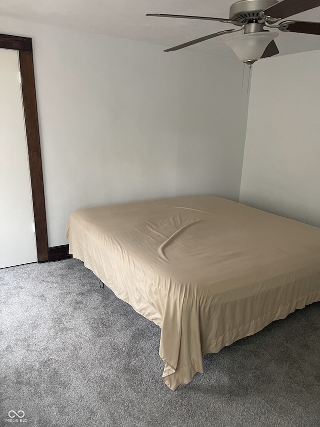 unfurnished bedroom featuring ceiling fan and carpet flooring