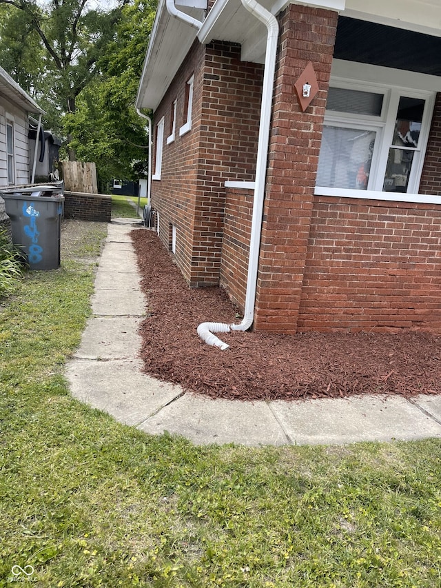 view of side of property with a yard