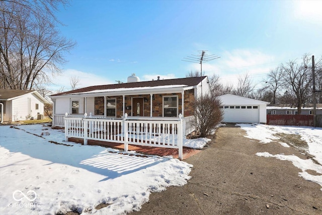 view of front of house with an outdoor structure, a porch, and a garage