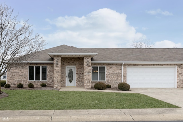 view of front of home featuring a garage and a front lawn