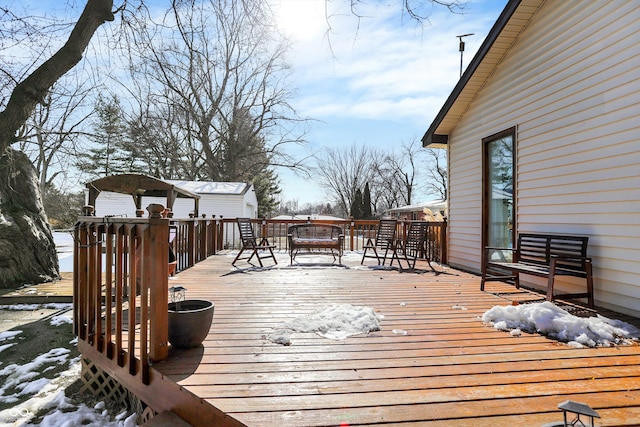 view of snow covered deck