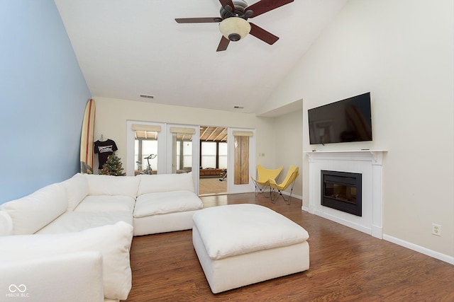 living room with ceiling fan, dark wood-type flooring, high vaulted ceiling, and french doors