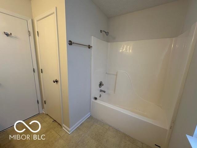 bathroom featuring  shower combination