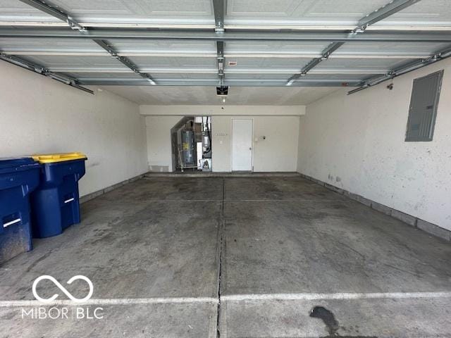 garage with electric panel, gas water heater, and a garage door opener