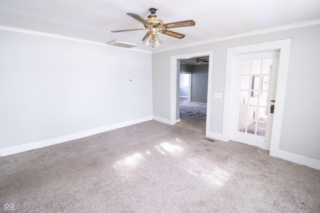 spare room featuring ceiling fan, ornamental molding, and carpet flooring