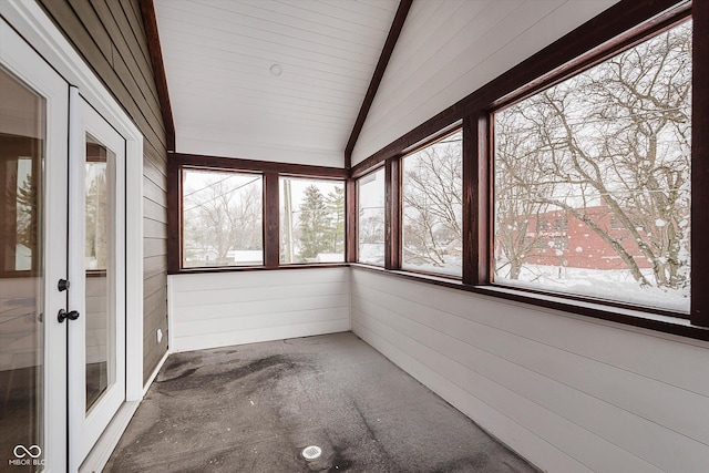 unfurnished sunroom featuring wood ceiling, lofted ceiling with beams, and french doors