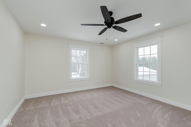 unfurnished room with light carpet and ceiling fan