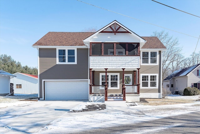 view of front of house with a porch and a garage