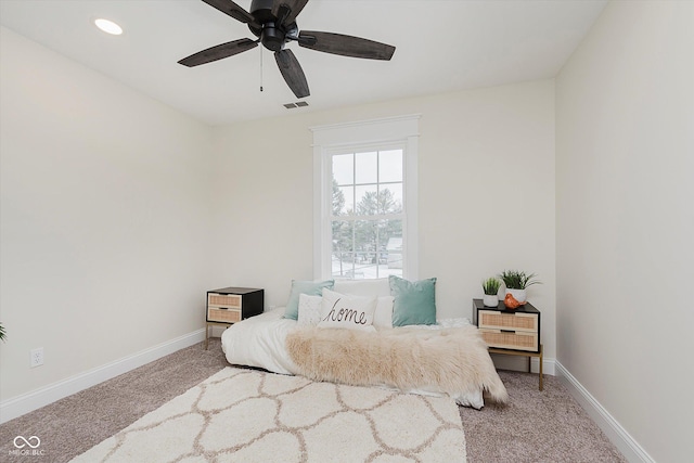 bedroom featuring light carpet and ceiling fan