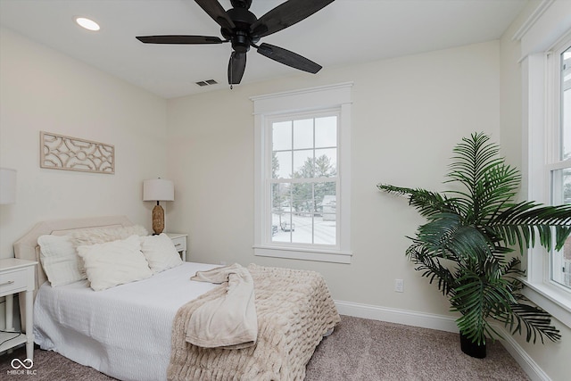 carpeted bedroom with ceiling fan