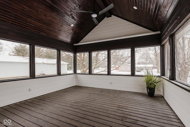 unfurnished sunroom featuring wood ceiling, ceiling fan, and vaulted ceiling