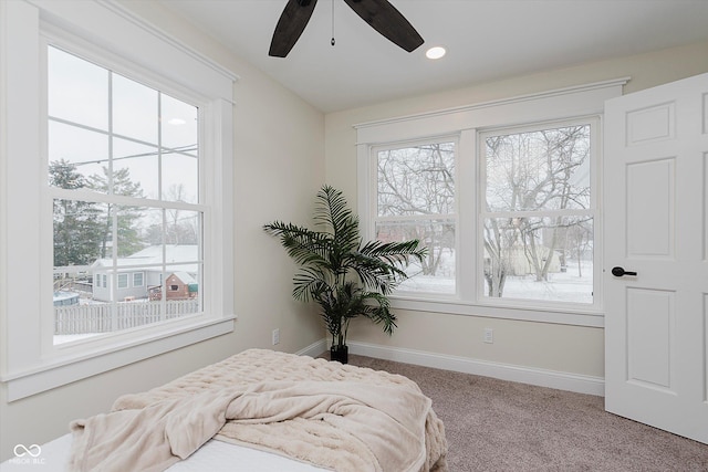 bedroom featuring light carpet and ceiling fan