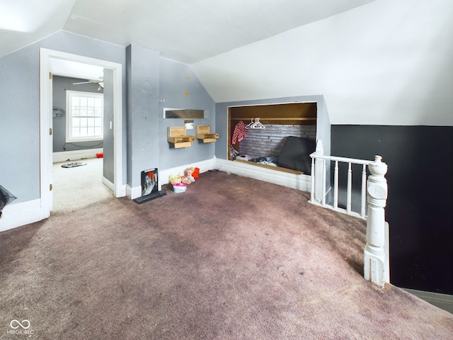 living room with vaulted ceiling and carpet floors