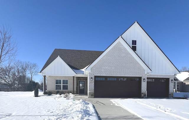 modern farmhouse style home featuring a garage