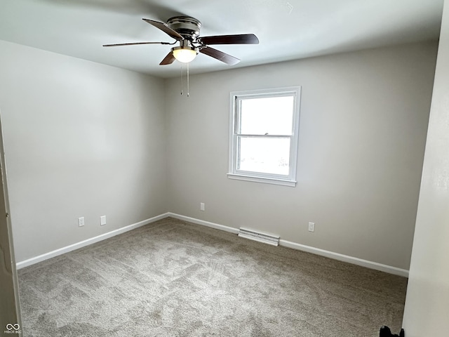 spare room featuring carpet floors and ceiling fan