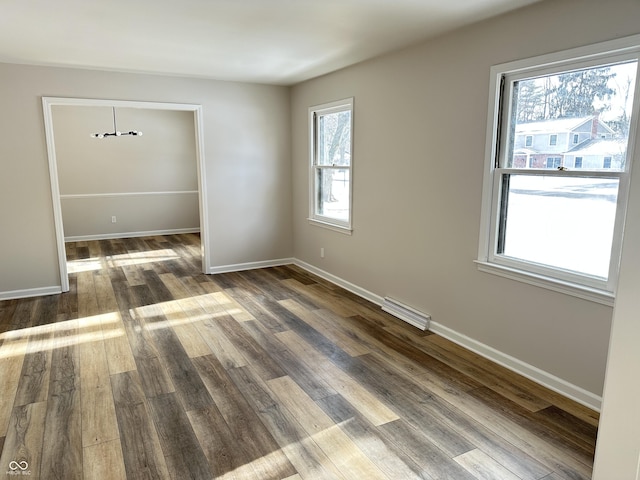 empty room featuring dark hardwood / wood-style floors