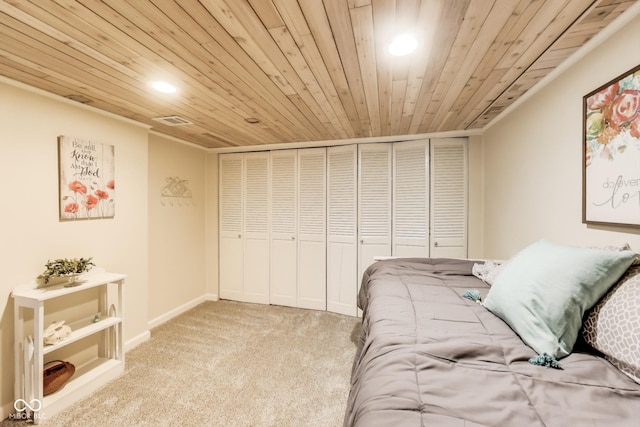 bedroom featuring light carpet, wooden ceiling, and a closet