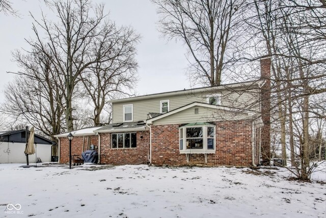 view of snow covered house