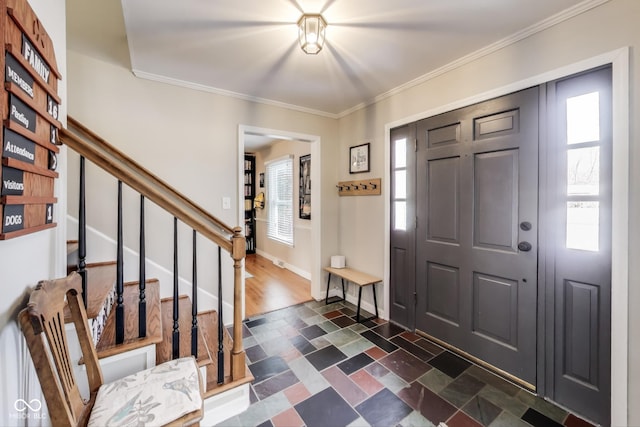 entryway featuring ornamental molding