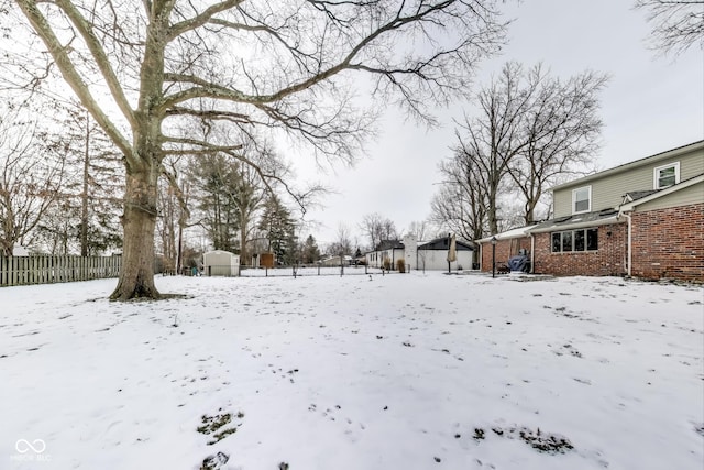 view of yard covered in snow