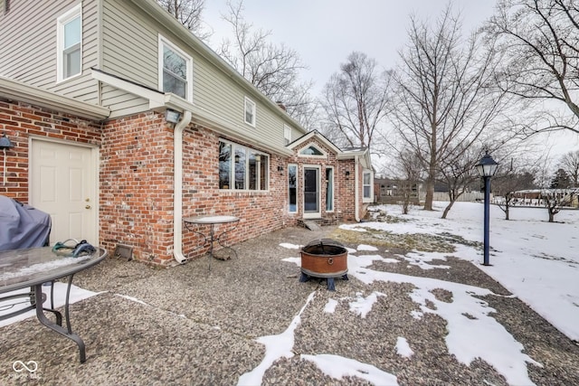 exterior space featuring an outdoor fire pit