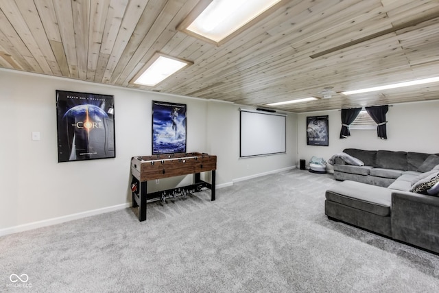 carpeted home theater room featuring wood ceiling