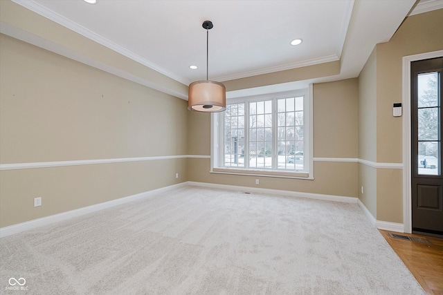 carpeted spare room with ornamental molding