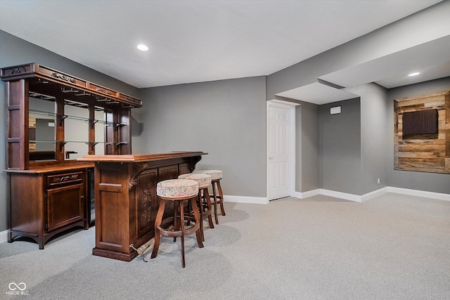 bar featuring light colored carpet