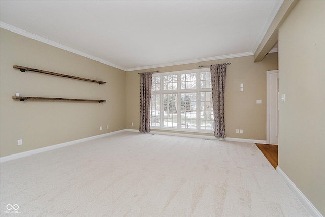 carpeted spare room with ornamental molding