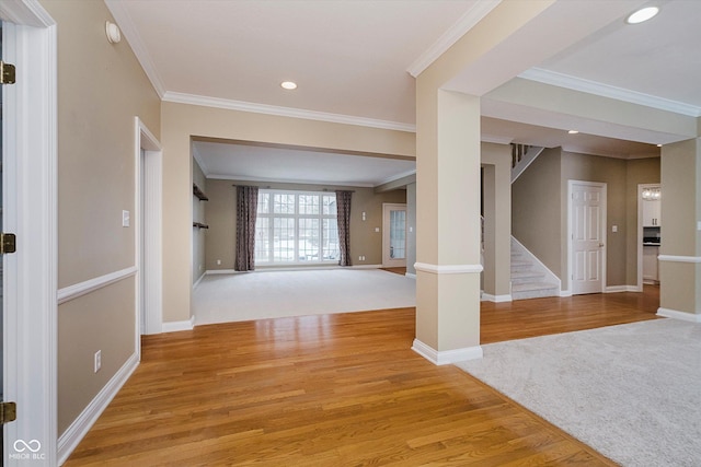 interior space with light carpet and ornamental molding